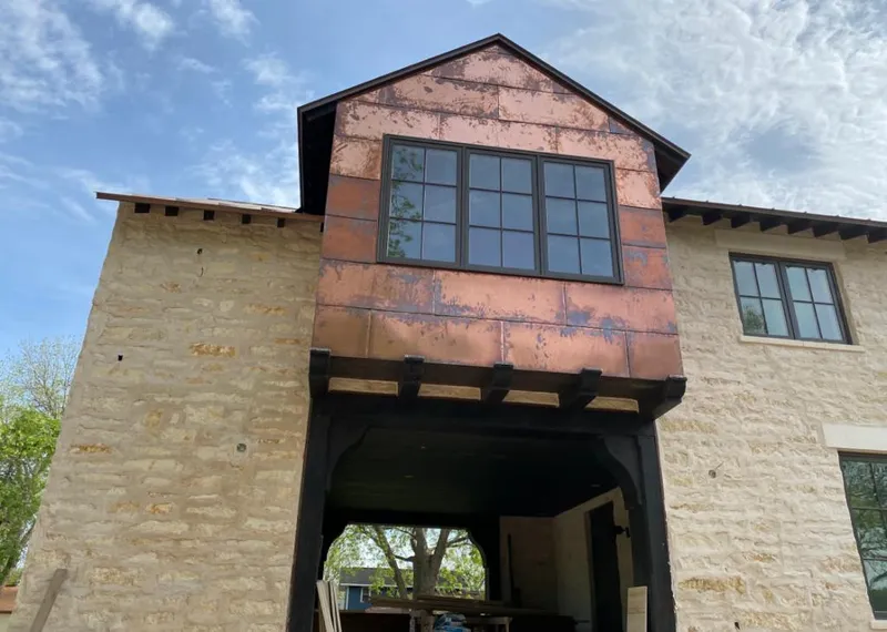 Copper metal panel facade on a stone building for Skylight Installation in Port St. Lucie