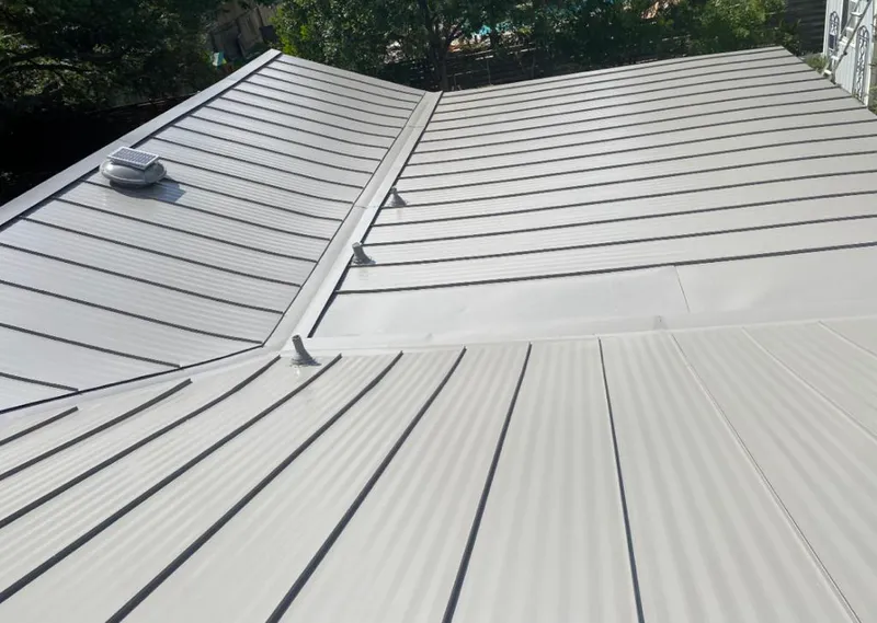 Solar attic fan installed on a metal roof for Roof Ventilation in Port St. Lucie